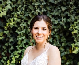 women in wedding photo smiling brown hair
