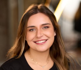 women in black shirt smiling brown hari