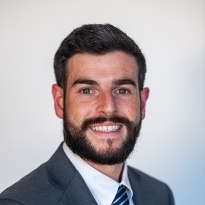 man smiling for headshot photo blue suite