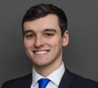 man in blue tie smiling
