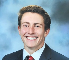 man smiling blue background